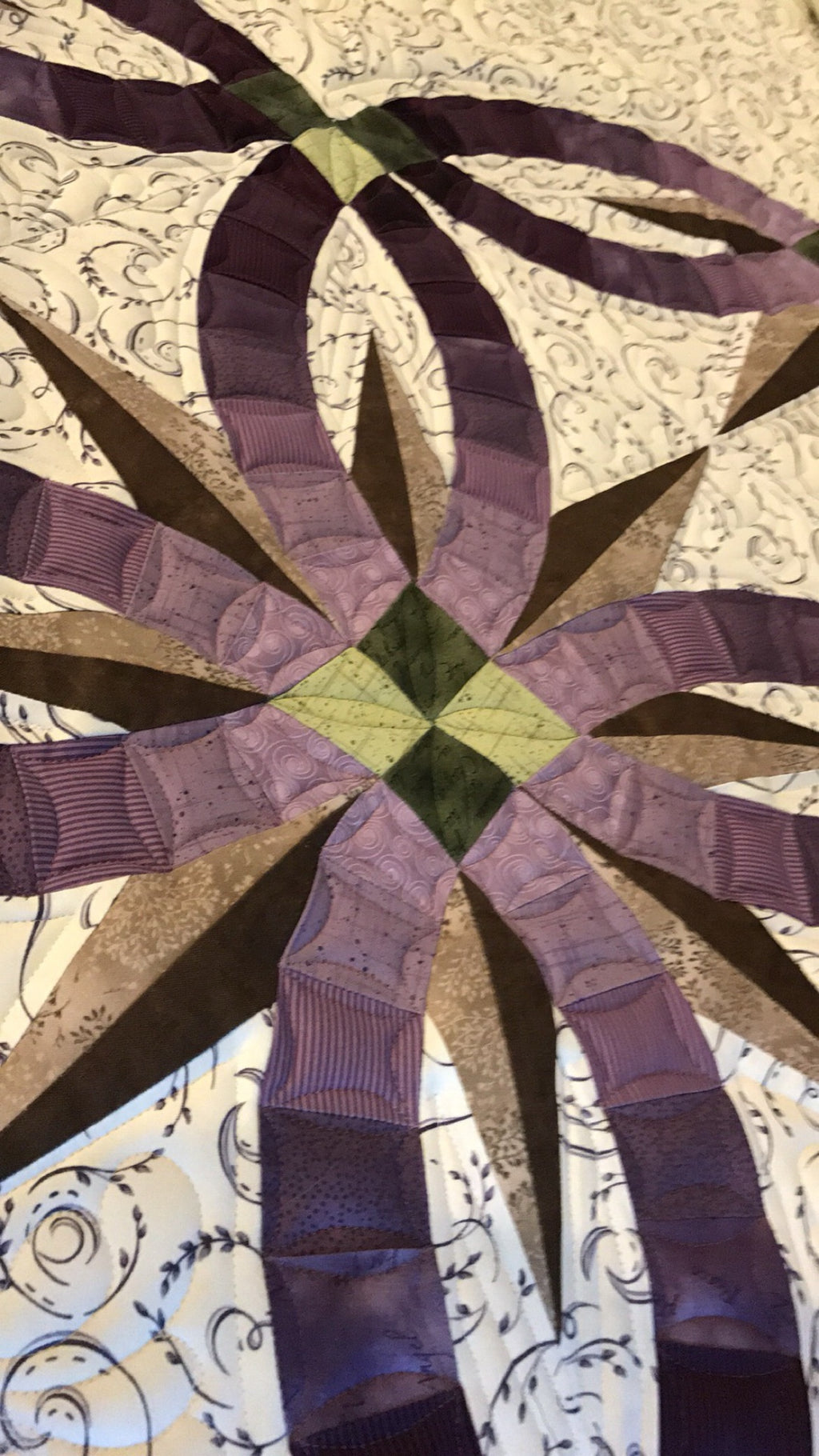 Double wedding ring quilt detail with edge-to-edge longarm quilting