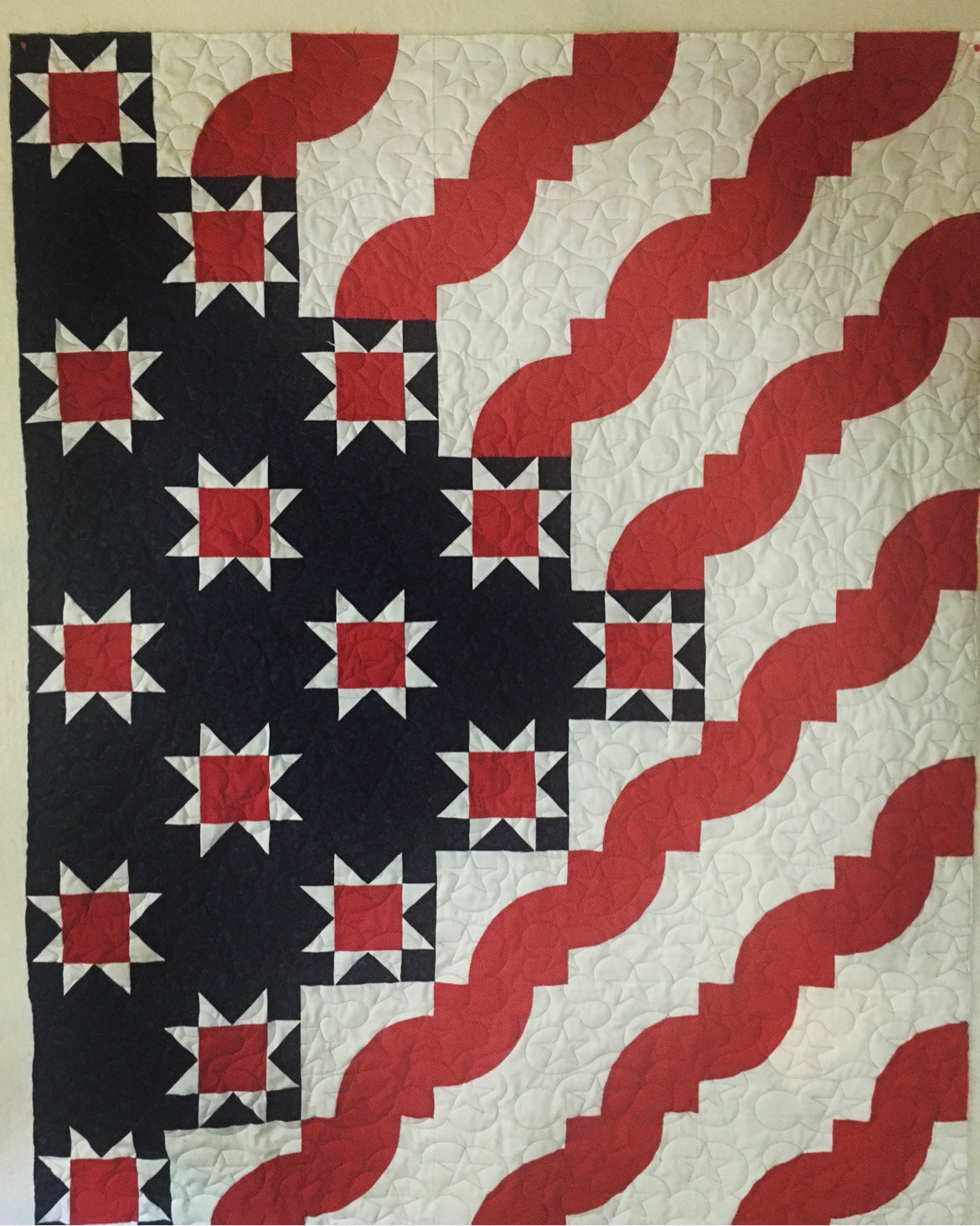 Longarm quilting machine in action quilting a quilt top on a 14 foot frame