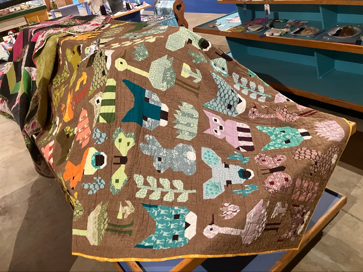 Owl quilt finished with edge-to-edge longarm quilting