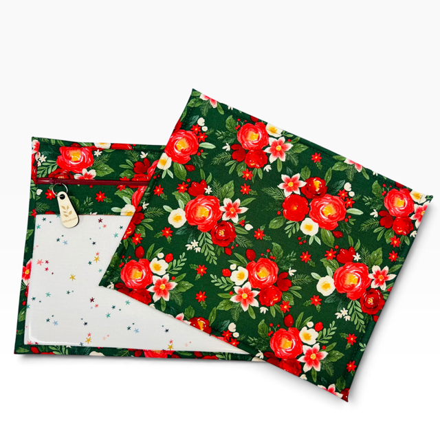 Handmade cross stitch project bag with clear vinyl window, Poinsettia Christmas Red Stars print — lifestyle view