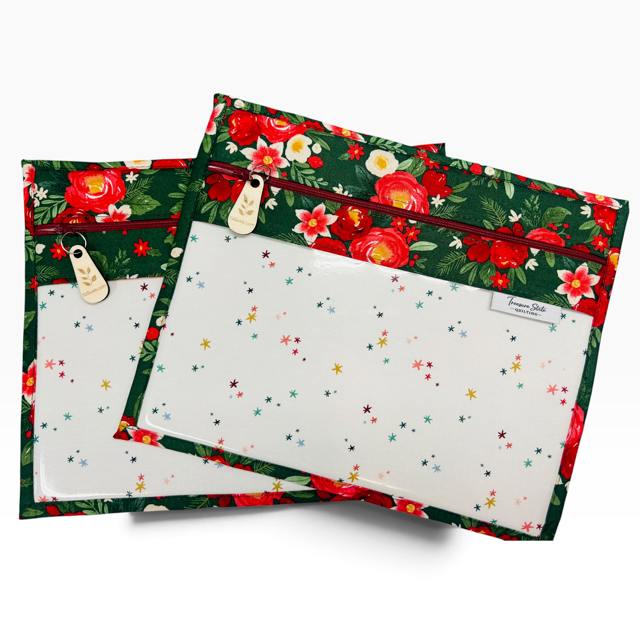 Handmade cross stitch project bag with clear vinyl window, Poinsettia Christmas Red Stars print — flat lay view